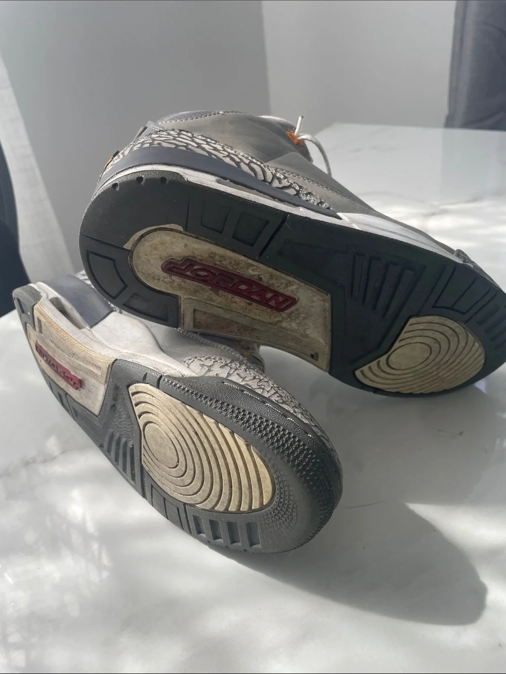 Jordan Gray and Black Retro Sneakers with Red Tongue Logo